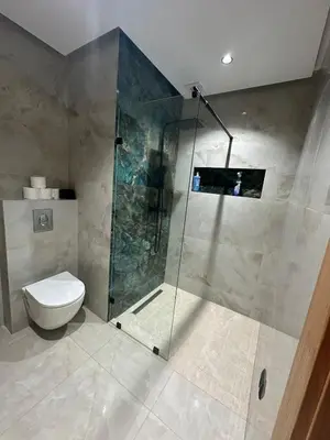 a bathroom with a shower and a toilet at Apartment Témara Ideal Center High Standing in Temara