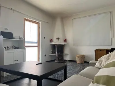 a living room with a coffee table and a window at Villa Cosy aux Sablettes, plage à deux pas in Mohammedia