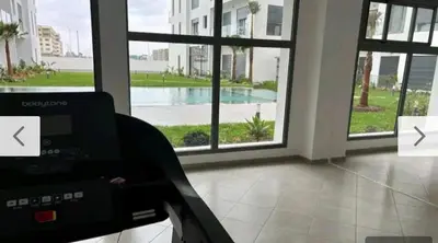 a room with a view of a large window at CMN airport apartment in Nouaseur
