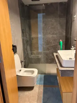 a bathroom with a toilet and a sink at CMN airport apartment in Nouaseur