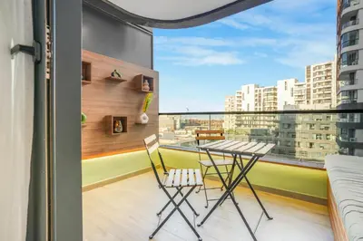 a table and chairs on a balcony with a view at Premium Stay Near Aeria Mall CFC- Feels like Home in Casablanca