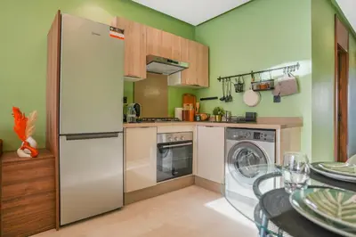 a kitchen with a refrigerator and a dishwasher at Premium Stay Near Aeria Mall CFC- Feels like Home in Casablanca