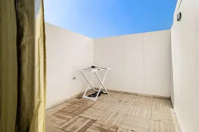 an empty room with a table in the corner at Appartement de luxe sur la Corniche in Casablanca