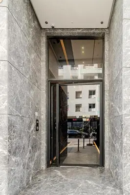 an entrance to a building with a glass door at Appartement de luxe sur la Corniche in Casablanca