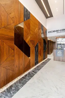 a wall of wood panels in a lobby at Appartement de luxe sur la Corniche in Casablanca