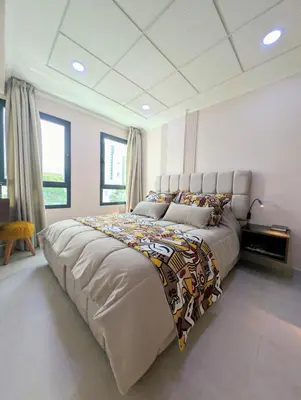 a bedroom with a large bed in a room at Comfort & Elegance, Station and Tram Access in Casablanca