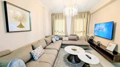 a living room with a couch and a table at Comfort & Elegance, Station and Tram Access in Casablanca