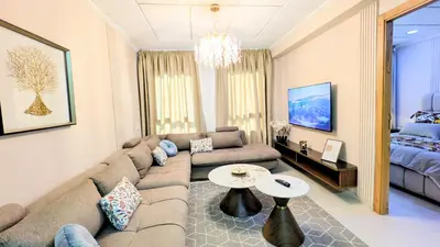 a living room with a couch and a table at Comfort & Elegance, Station and Tram Access in Casablanca