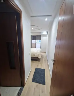 a hallway with a bed in a room with a door at T3 confort Casablanca in Casablanca