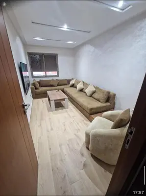 a living room with two couches and a table at T3 confort Casablanca in Casablanca