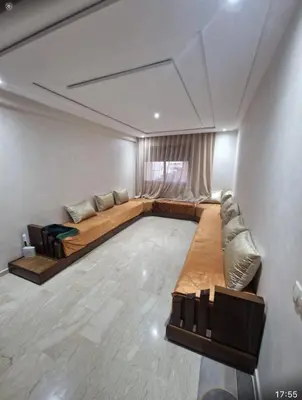 a living room with a bed and a couch at T3 confort Casablanca in Casablanca
