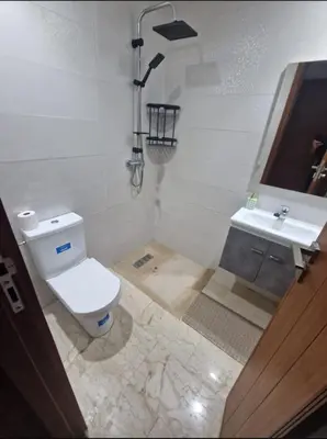 a bathroom with a toilet and a sink at T3 confort Casablanca in Casablanca