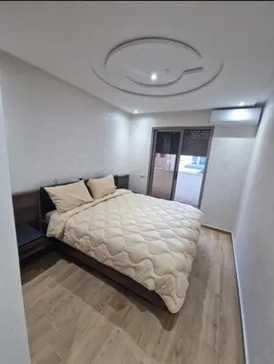 a bedroom with a large bed in a room at T3 confort Casablanca in Casablanca