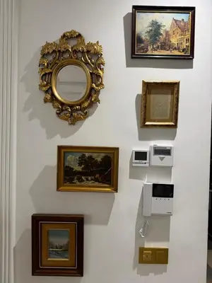 a group of framed pictures on a wall at Cosy and charming studio - parking & Terasse in Maarif