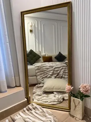 a mirror in a room with a couch at Cosy and charming studio - parking & Terasse in Maarif