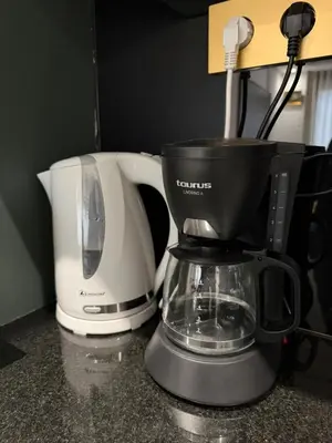 a coffee maker and a blender on a counter at Cosy and charming studio - parking & Terasse in Maarif