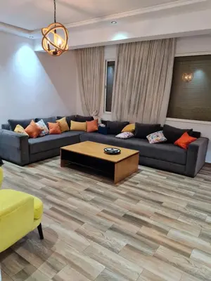 a living room with couches and a coffee table at Adnani in Temara