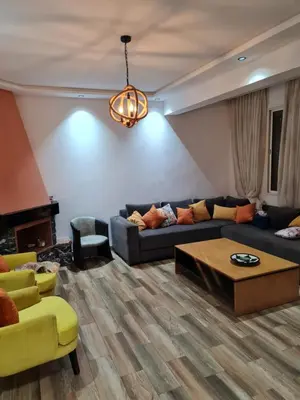 a living room with a couch and a coffee table at Adnani in Temara