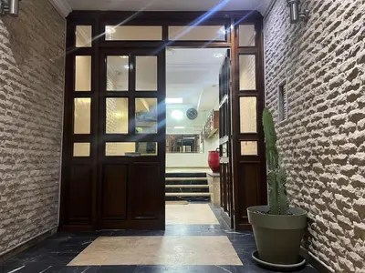 a door leading into a hallway with a potted plant at Perle de rabat 2 in Rabat
