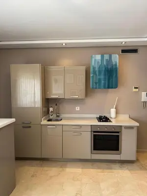 a kitchen with white cabinets and a stove at Nice studio for rent in Casablanca