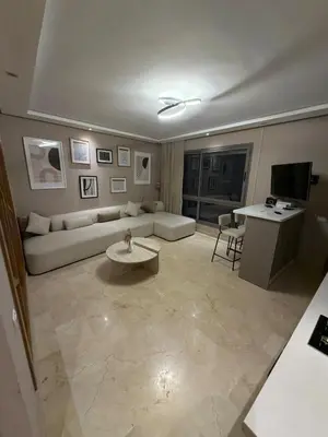 a living room with a couch and a table at Nice studio for rent in Casablanca