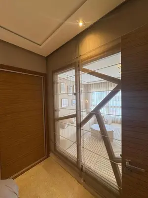 a room with a large window with a view of a balcony at Nice studio for rent in Casablanca