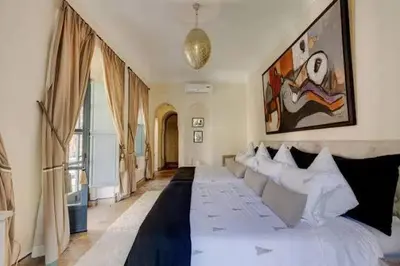 a living room with a large white bed in it at Vbilla 5 stars in Tamaris