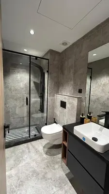 a bathroom with a toilet and a sink and a shower at Central Casablanca Cozy Home in Casablanca