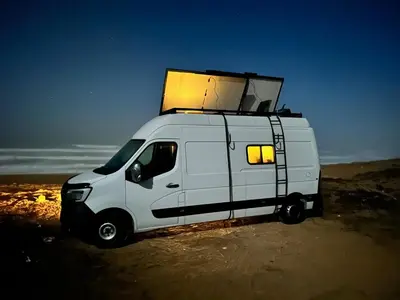 a white van with a box on top of it at Van aménagé tout confort in Tamaris