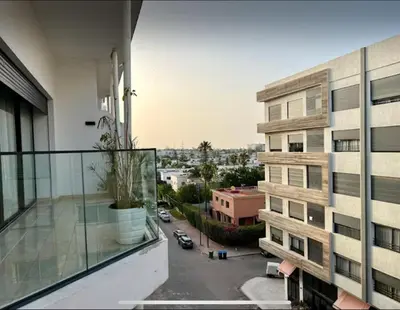 an apartment balcony with a view of a parking lot at Anfa City in Casablanca