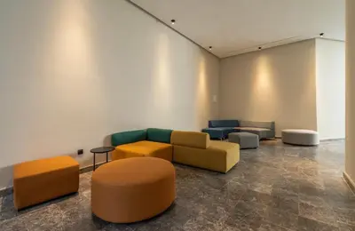 a living room with couches andools in a room at Chic Studio I Anfa Park & CFC I Gym Wifi & Parking in Casablanca