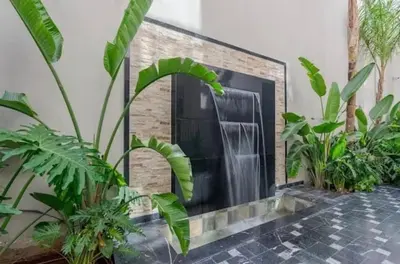 a fireplace in a room with plants at Chic Studio I Anfa Park & CFC I Gym Wifi & Parking in Casablanca