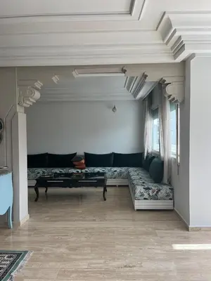 a living room with a couch and a table at High Standing Apartment in Casablanca in Casablanca