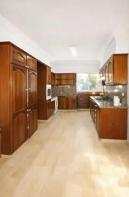 a large kitchen with wooden cabinets and a counter top at High Standing Apartment in Casablanca in Casablanca