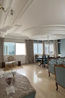 a living room with a couch and a table at High Standing Apartment in Casablanca in Casablanca