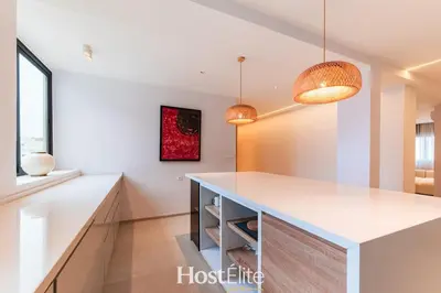 a kitchen with a white counter and two pendant lights at Exceptional Private Room 1 SandRose in Casablanca