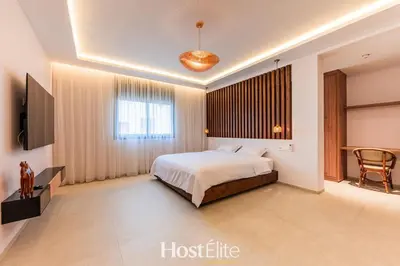 a bedroom with a bed and a television in a room at Exceptional Private Room 1 SandRose in Casablanca