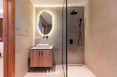 a bathroom with a shower with a sink and a mirror at Exceptional Private Room 1 SandRose in Casablanca