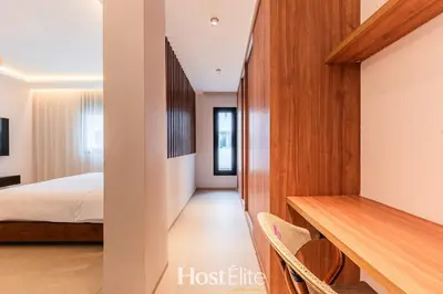 a bedroom with a bed and a desk with chairs at Exceptional Private Room 1 SandRose in Casablanca