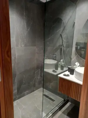 a bathroom with a shower and a sink at Elegance Comfort Terrace in the heart of Princesses in Maarif