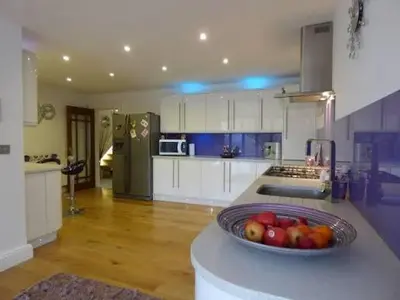 a kitchen with a bowl of fruit on a counter at Apparemment d été in Tamaris