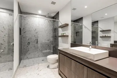 a bathroom with a shower and a sink and a toilet at Apparemment d été in Tamaris