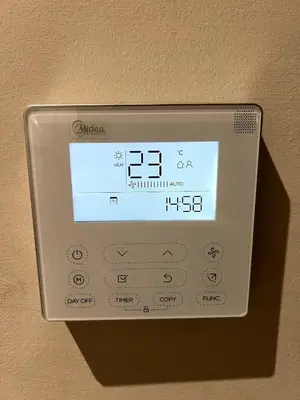 an alarm clock on a wall with a clock on it at Apartment - Casablanca - Palmiers in Casablanca