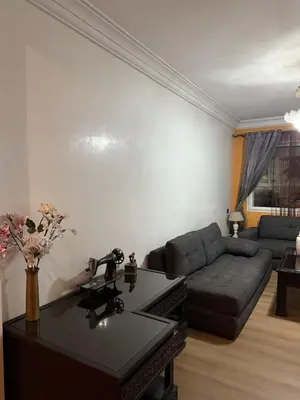 a living room with a couch and a table at Comfortable apartment in Casablanca Assalam in Casablanca