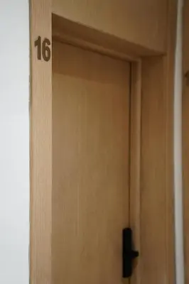 a wooden door with the number on it at Contemporary Moroccan elegance in the heart of Casa in Casablanca