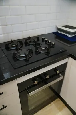a black stove top oven in a kitchen at Contemporary Moroccan elegance in the heart of Casa in Casablanca