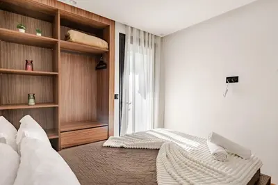 a bedroom with a bed and a window at Dynasty Estate Luxury Apartments in Palmiers, Casablanca in Maarif