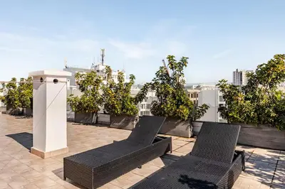 two wicker chairs sitting on top of a roof at Dynasty Estate Luxury Apartments in Palmiers, Casablanca in Maarif