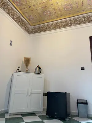 a room with a coffered ceiling and a white cabinet at Cozy getaway for a perfect stay in Rabat