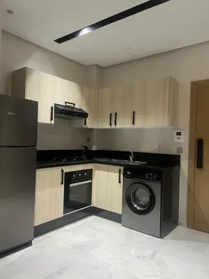 a kitchen with a washing machine and a washer at Studio océan park in Casablanca